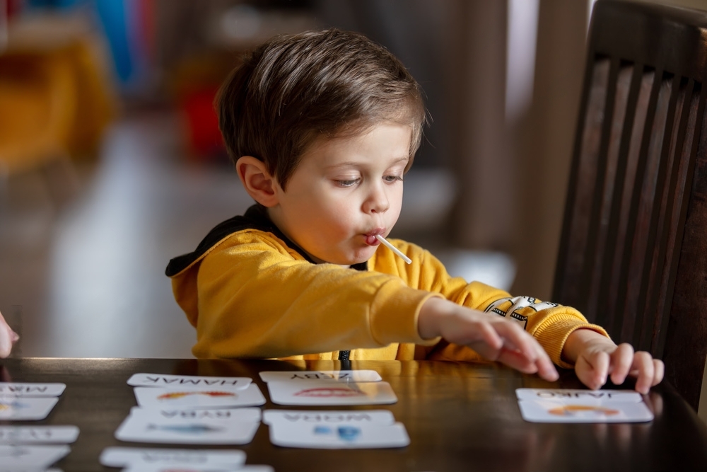 Little Boy with Cards